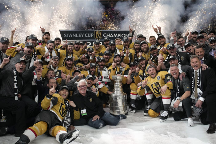 Members of the Vegas Golden Knights pose with the Stanley Cup after the Knights defeated the Florida Panthers 9-3 in Game 5 of the NHL hockey Stanley Cup Finals Tuesday, June 13, 2023, in Las Vegas. The Knights won the series 4-1.