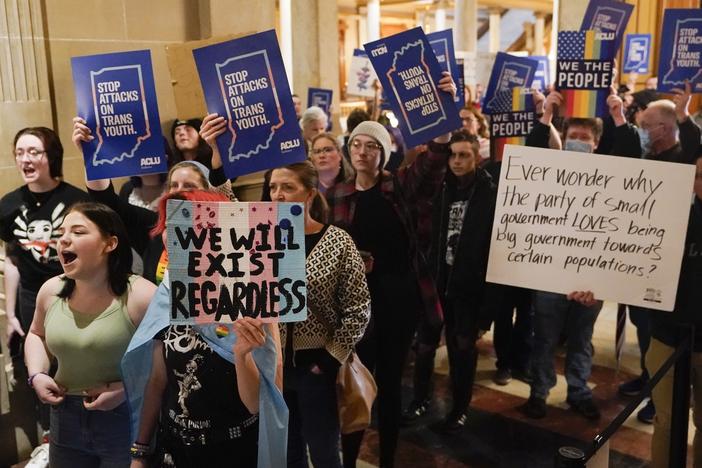 Protesters stand outside of the Senate chamber at the Indiana Statehouse on Feb. 22, 2023, in Indianapolis.