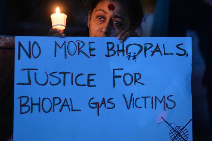 Members of the Bengaluru Solidarity Group in Support of the Bhopal Struggle take part in a candlelight vigil to commemorate the 30th anniversary of the Bhopal gas disaster in Bangalore on December 2, 2014.