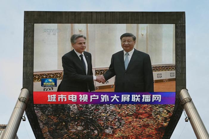 A China Central Television news broadcast shows footage of U.S. Secretary of State Antony Blinken meeting with China's President Xi Jinping on Monday.