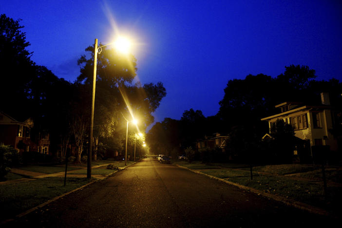Forrest Avenue, in the South Highland neighborhood, is dark except for streetlights in the early hours of Saturday, June 17, 2023, following a storm, in Shreveport, La.