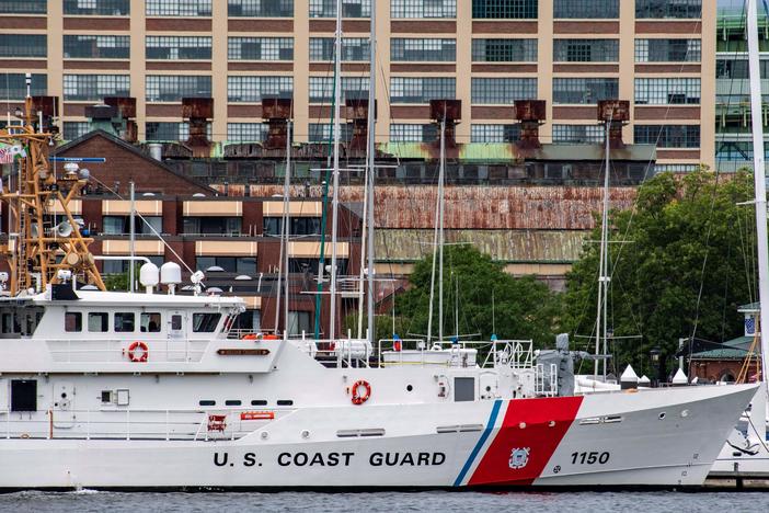 A U.S. Coast Guard vessel sits in port in Boston Harbor on Monday amidst the search for the submersible.