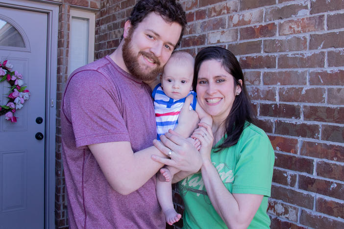 Teacher Karli Myers poses with her husband, Jordan Myers, and their seven-month-old, Luke. Karli spent years stockpiling sick leave in order to have time at home with Luke after he was born.