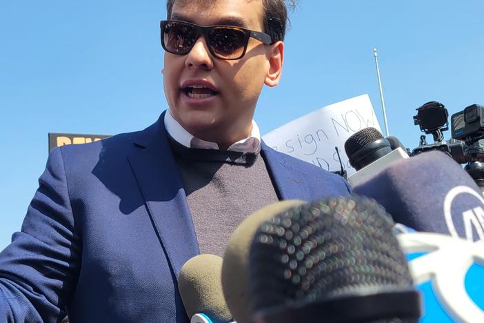 Rep. George Santos (R-NY3) speaking to reporters outside a federal courthouse on Long Island in May after he was charged with 13 federal crimes.