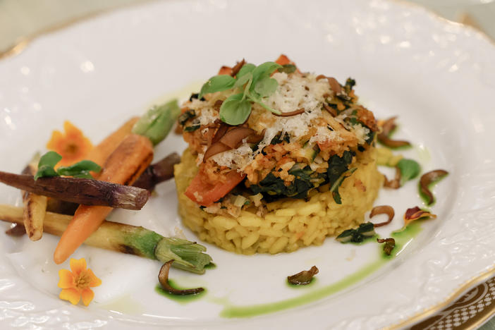 The main course of the dinner includes a stuffed portobello mushroom and creamy saffron-infused risotto. A fish entree is available to order upon request.