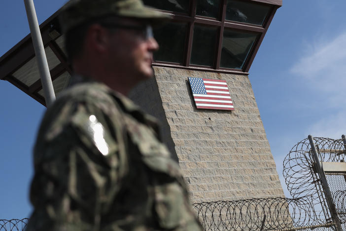 A U.S. Naval officer stands at the entrance of the U.S. prison at the U.S. Naval Station at Guantánamo Bay, Cuba, on Oct. 22, 2016.