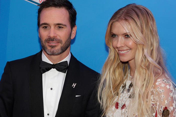 Jimmie Johnson and his wife Chandra Janway pose on the red carpet before the NASCAR Sprint Cup Series auto racing awards in Las Vegas, Dec. 2, 2016.