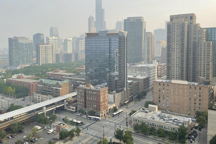 Haze from Canadian wildfires blankets the Chicago skyline as seen from the city's South Loop neighborhood on Wednesday.