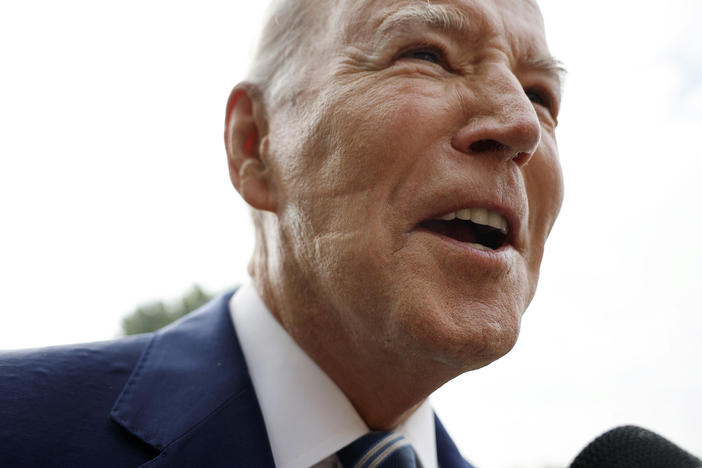 President Biden talks to reporters as he departs the White House on Wednesday. After reporters pointed out the marks on his face, the White House revealed the president used a CPAP machine, used by people who have sleep apnea, Tuesday night.