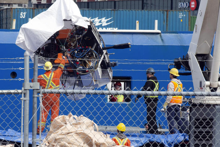Debris from the Titan submersible, recovered from the ocean floor near the wreck of the Titanic, is unloaded from the ship Horizon Arctic at the Canadian Coast Guard pier in St. John's, Newfoundland, Wednesday, June 28, 2023.