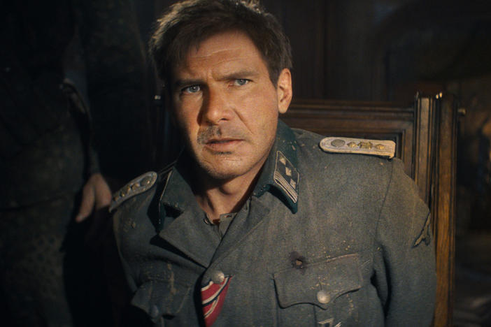 The excellent summer movie season is what's making Chris Klimek happy this week. Above, a digitally de-aged Harrison Ford in <em>Indiana Jones and the Dial of Destiny. </em>