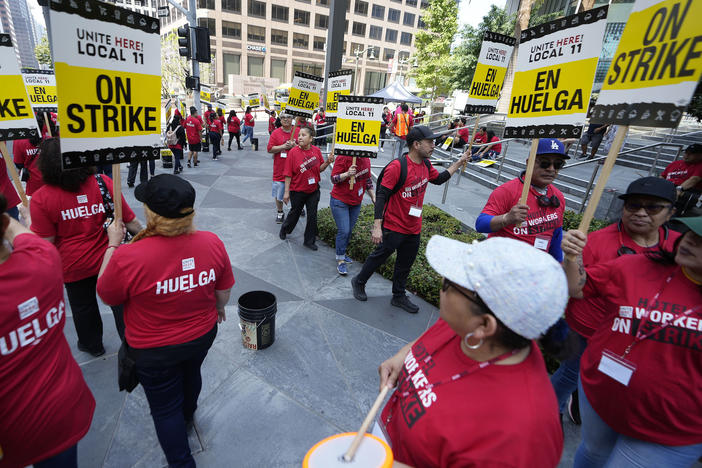 Striking hotel workers rally outside the InterContinental Hotel after walking off their job early Sunday, July 2, 2023, in downtown Los Angeles.