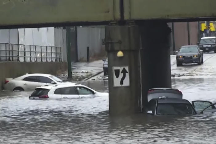 In this image taken from video provided by ABC7 Chicago, several vehicles are stranded in the flooded viaduct at Fifth and Cicero avenues, in Chicago, Sunday, July 2, 2023.