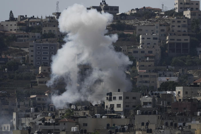 Smoke rises during an Israeli military raid of the militant stronghold of Jenin in the occupied West Bank, Monday, July 3, 2023.