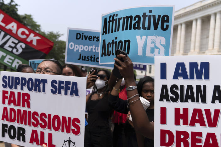Demonstrators protest outside of the Supreme Court in Washington, Thursday, June 29, 2023, after the Supreme Court struck down affirmative action in college admissions, saying race cannot be a factor.
