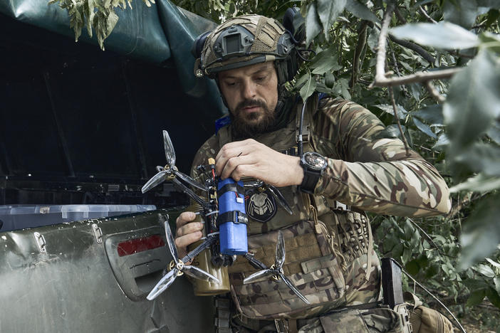A Ukrainian soldier prepares a drone on the frontline in the Zaporizhzhia region, Ukraine, Saturday, July 1, 2023.
