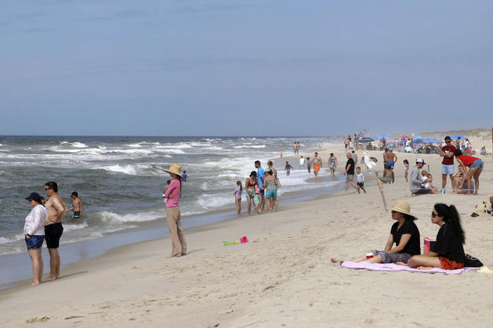 People are seen at Field 3 at Robert Moses State Park in West Islip, N.Y., Tuesday, July 4, 2023.