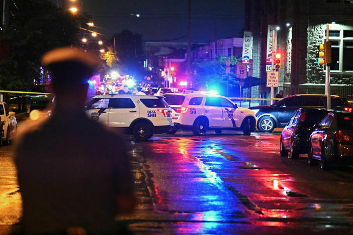Police work the scene of a July 3 shooting in the Kingsessing section of Philadelphia.