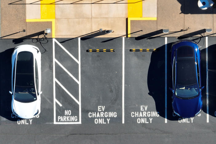 Tesla vehicles recharge in February in Corte Madera, Calif. The government wants to accelerate the transition to electric vehicle, but how fast the country can actually move is being hotly debated.