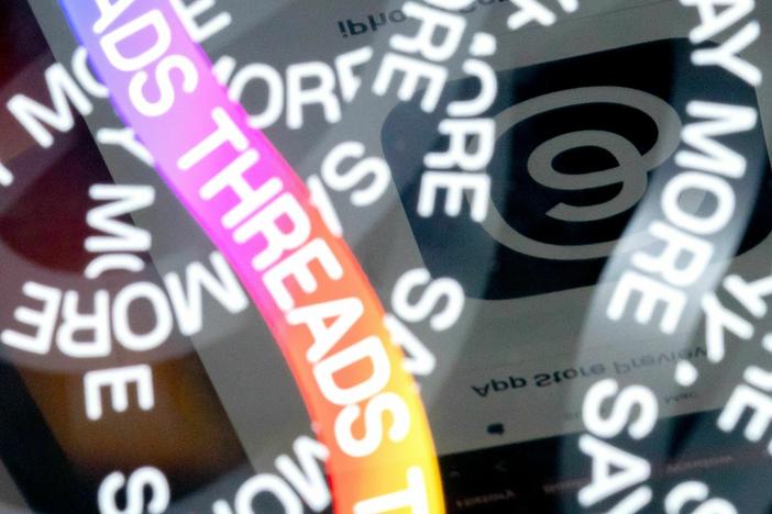 A photo illustration shows the logo for Meta's Threads, an app that gained over 10 million users overnight.