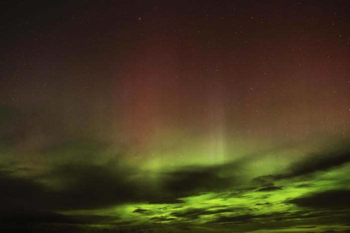 An aurora borealis, also known as the northern lights, is seen in the sky in the early morning hours of April 24, near Washtucna, Wash.