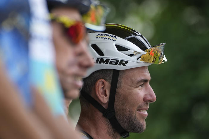 Britain's Mark Cavendish (right) smiles prior to the fourth stage of the Tour de France in Nogaro, France on Tuesday. The ace sprinter crashed out of the race during the eighth stage on Saturday.