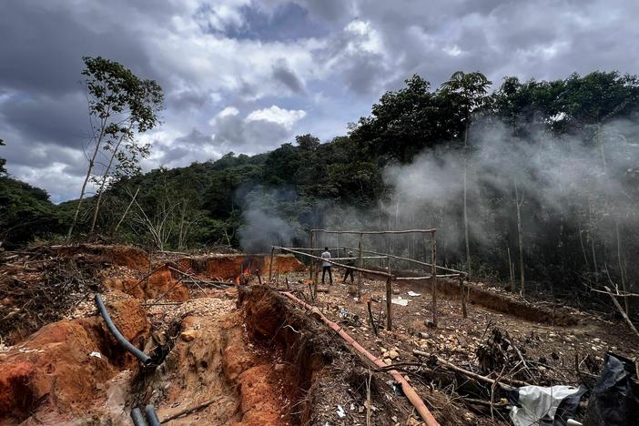 An officer of the Brazilian Institute of Environment and Renewable Natural Resources (IBAMA) takes part in an operation against Amazon deforestation at an illegal mining camp, known as garimpo, at the Yanomami territory in Roraima State, Brazil, on February 24.