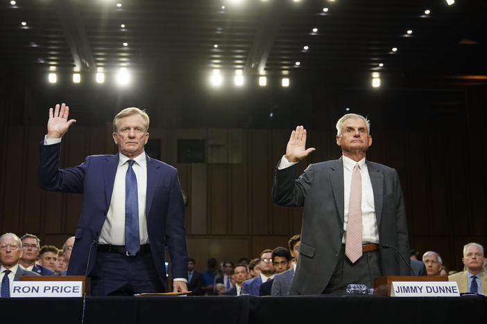PGA Tour Chief Operating Officer Ron Price, left, and PGA Tour board member Jimmy Dunne are sworn in before testifying at a Senate hearing on the proposed PGA Tour-LIV Golf partnership on July 11.