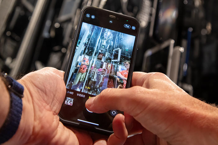 Museum visitors explore <em>Cellphone: Unseen Connections </em>at the Smithsonian's National Museum of Natural History.