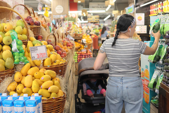 People shop at a market in Brooklyn, New York City, on June 12, 2023.