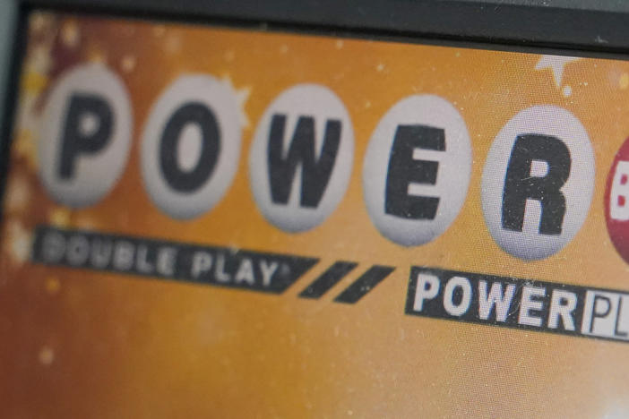 A display panel advertises tickets for a Powerball drawing at a convenience store, Nov. 7, 2022, in Renfrew, Pa. The Powerball jackpot soared to an estimated $875 million after no winning ticket was sold for Wednesday's drawing.