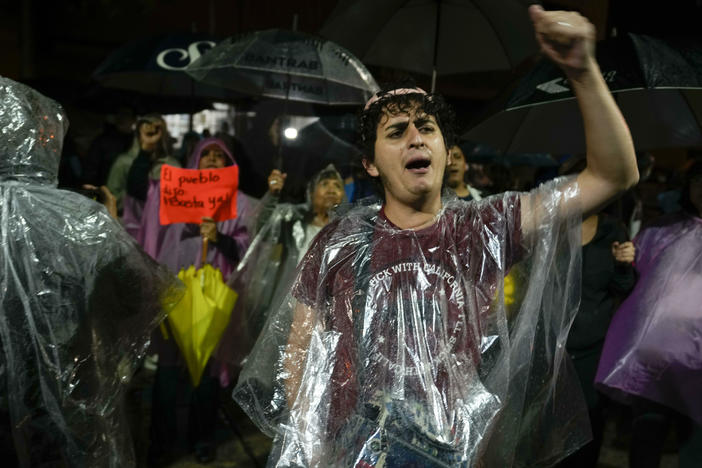 Protesters gather in front of the Supreme Electoral Tribunal building in Guatemala City, Wednesday. The tribunal certified presidential election results, sending candidates Sandra Torres and Bernardo Arévalo to an Aug. 20 runoff, while the Attorney General's Office announced that Arévalo's party had been suspended.