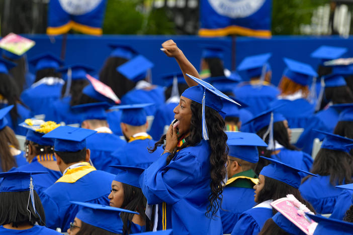 Graduates attend Tennessee State University's commencement ceremony in Nashville on May 7, 2022. Under a new repayment plan, millions of student loan borrowers will see their monthly repayment amounts cut in half or more.