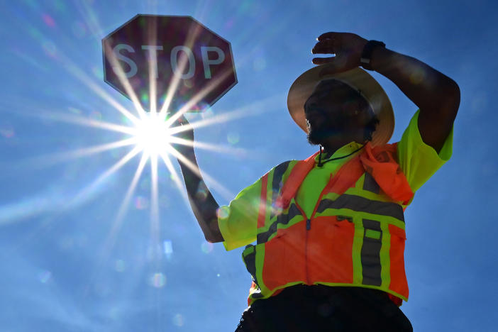Traffic warden Rai Rogers mans his street corner during temperatures as high as 106 in Las Vegas, Nevada on Wednesday.