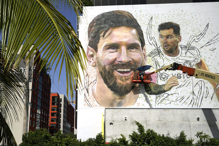 Artist Maximiliano Bagnasco paints a mural of Argentine soccer star Lionel Messi on July 10 in the Wynwood neighborhood of Miami.