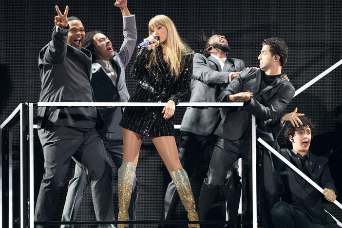 Taylor Swift performs "The Man" during her Eras tour show in Arlington, Texas, in March. She just became the first woman to have four Top 10 charting albums at once.