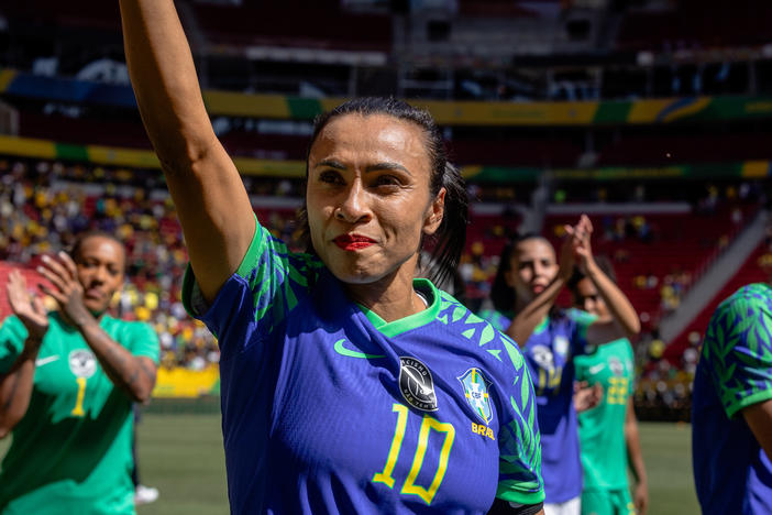 Marta and the Brazilian women's soccer team walk around the field greeting fans after a friendly match against Chile ahead of the World Cup, in Brasília, Brazil, on July 2.