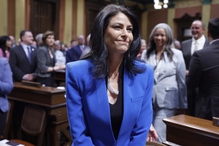 Michigan Attorney General Dana Nessel walks to her seat before the State of the State address on Jan. 25 at the state Capitol in Lansing, Mich.