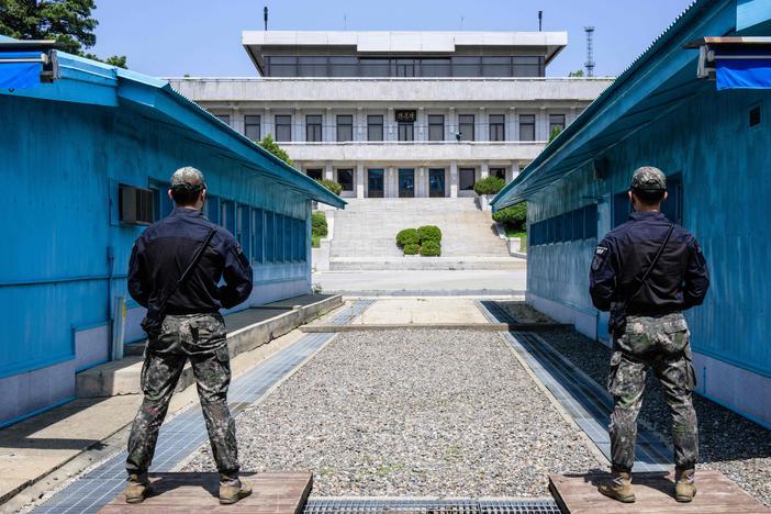 In this photo taken on May 9, South Korean soldiers stand guard as they face North Korea in the Joint Security Area of the Demilitarized Zone separating North and South Korea.