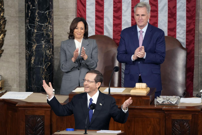 Israeli President Isaac Herzog arrives to speak to a joint meeting of Congress on Wednesday morning at the Capitol in Washington, as Vice President Kamala Harris and House Speaker Kevin McCarthy of Calif., look on.