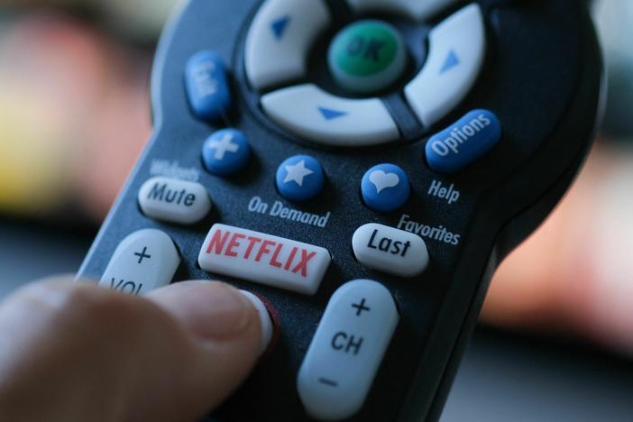 Netflix announced steady growth in its Q2 2023 earnings report. Above, the Netflix logo appears on a TV remote in July 2022.