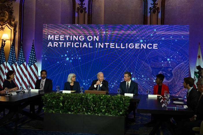 President Biden is pictured with leaders on artificial intelligence during a visit to San Francisco on June 20. On Friday, the White House announced voluntary agreements with technology companies on managing AI.