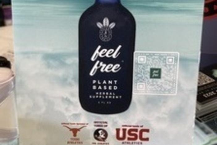 The counter at Glass Chamber smoke shop in West Palm Beach, Fla., features an ad for Feel Free, a tonic sponsored by the athletic departments of the University of Texas, Florida State University and the University of Southern California. The ad doesn't mention that Feel Free contains kratom, a controversial herb linked to fatal overdoses.