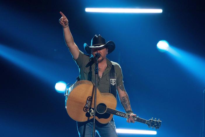 Country music singer Jason Aldean, pictured here performing at the Academy of Country Music Awards in Frisco, Texas in May, is facing a mixed bag of backlash and praise for a new music video that openly alludes to vigilante justice.