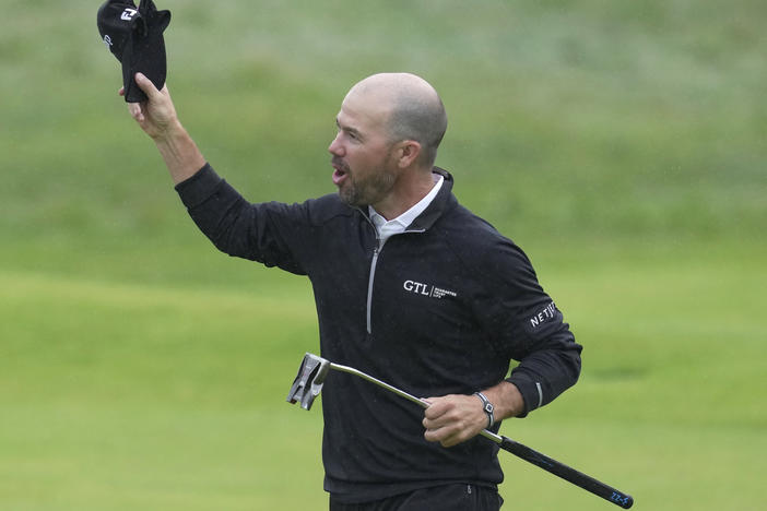 Brian Harman celebrates on the 18th green after winning the British Open Golf Championships at the Royal Liverpool Golf Club in Hoylake, England, on Sunday.