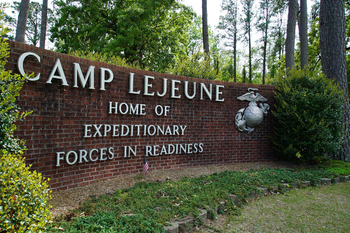 Signage stands on the main gate to Camp Lejeune Marine Base outside Jacksonville, N.C., Friday, April 29, 2022.