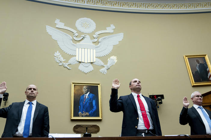 Ryan Graves, executive director of Americans for Safe Aerospace (left), retired Air Force Maj. David Grusch and retired Navy Cmdr. David Fravor are sworn in during a House Oversight and Accountability subcommittee hearing on UFOs on Wednesday.