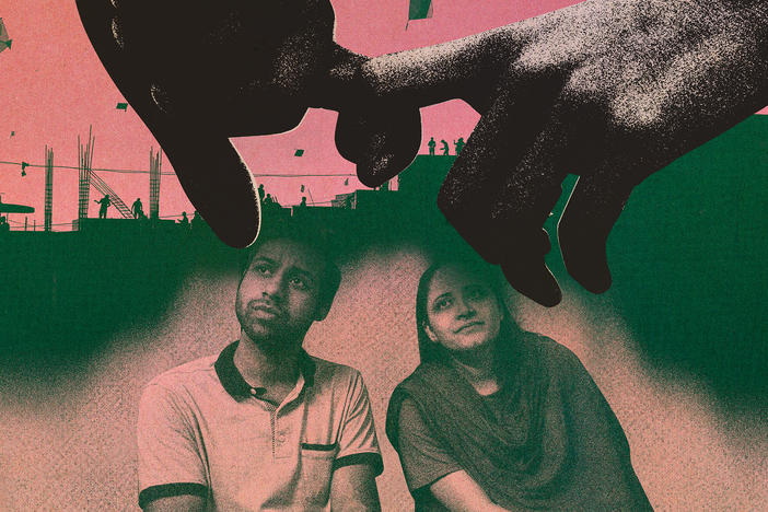 Saumil and Zarina sit on the floor at the Love Commandos shelter in New Delhi.