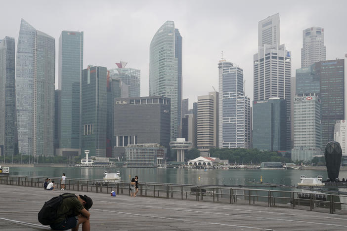 A man takes a nap as the central business district is shrouded by haze in Singapore, on Sept. 23, 2019. Singapore executed a man Wednesday, July 26, 2023, for drug trafficking and is set to hang a woman Friday — the first in 19 years — prompting renewed calls for a halt to capital punishment.