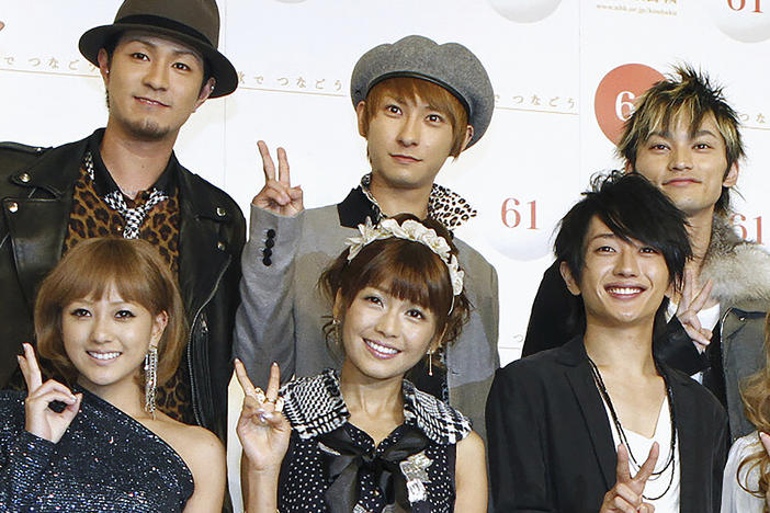 Japanese pop star Shijiro Atae, rear center, poses with others during an announcement for a year-end TV music show in Tokyo on Nov. 24, 2010. Atae said he is gay in an emotional announcement at a fan event Wednesday, July 26, 2023, that was warmly welcomed in a country where the government does not recognize LGBTQ equality. (Kyodo News via AP)
